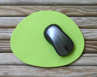 May include: A green felt mouse mat with a grey computer mouse on top.