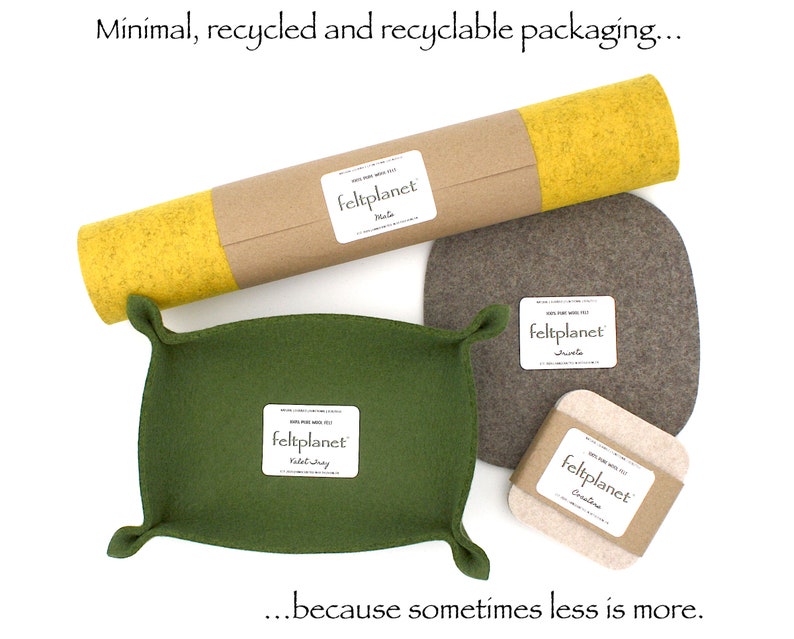 May include: A set of felt items, including a tray, coasters, and a roll of felt, all packaged in a simple brown paper tube. The felt items are in various shades of green, brown, and yellow. The packaging is labeled "feltplanet".
