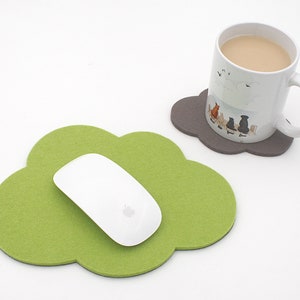 May include: A green felt cloud-shaped mouse pad with a white wireless mouse on top. A gray felt cloud-shaped coaster with a white mug on top.