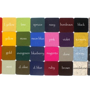 May include: A set of 40 felt squares in various colours, each with a colour name written in white text. The colours include fire, yellow, lime, spruce, navy, bordeaux, black, taupe, cherry, yellow, moss, neon blue, pink, violet, turmeric, granite, orange, gold, evergreen, blueberry, magenta, dune, stormy, anthracite, rust, mint, olive, blue, ruby, brown, sandstone, and grey.