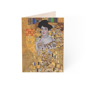May include: A painting of a woman in a gold dress with a geometric pattern. The background is a gold and black abstract design.