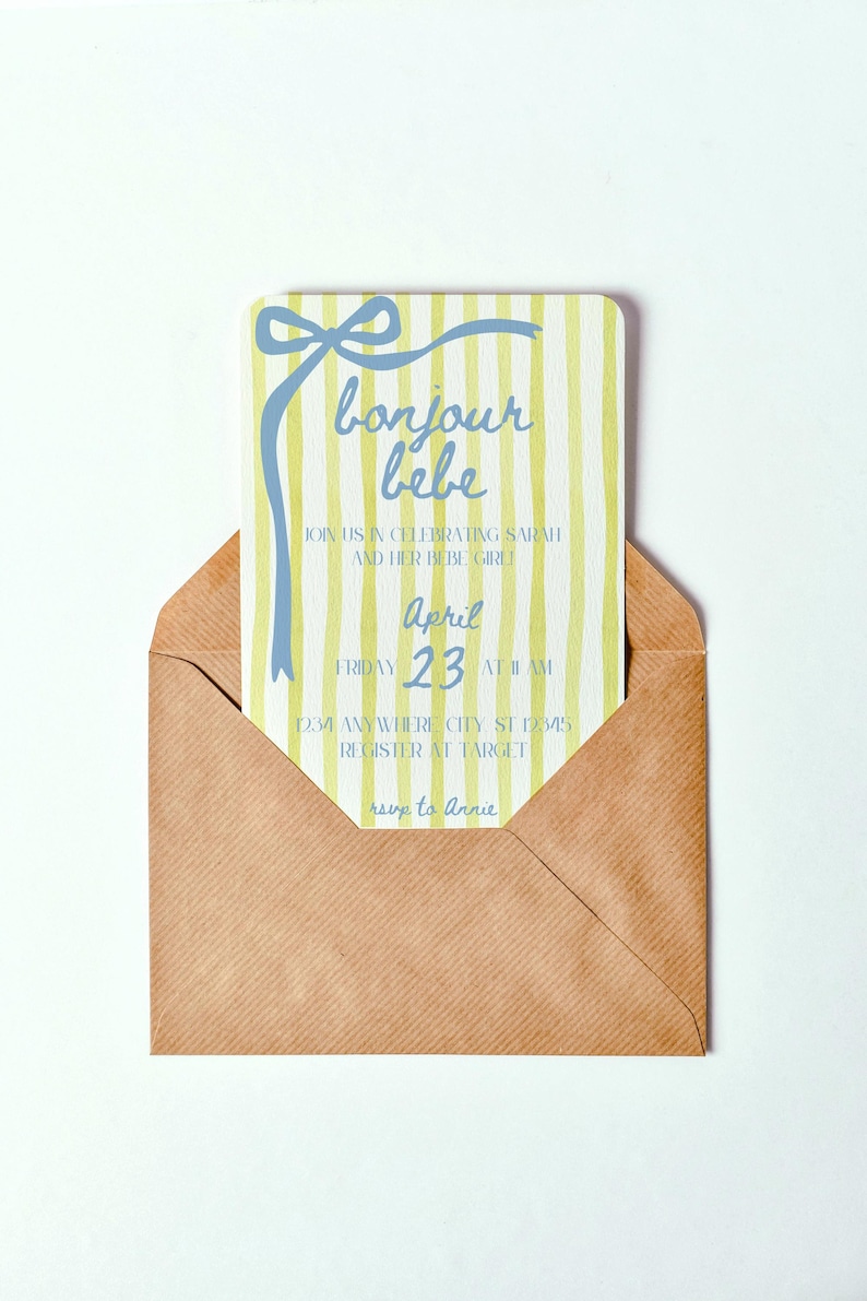 May include: A yellow and white striped baby shower invitation with blue text that reads "bonjour bebe". The invitation includes the date "April 23" and the time "11 AM".