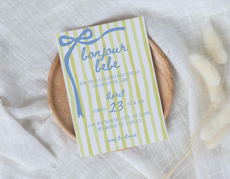 May include: A yellow and blue striped baby shower invitation with the text "bonjour bebe" and the date "April 23".