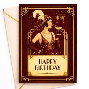 May include: A birthday card with a vintage art deco design. The card features a woman in a flapper dress holding a champagne glass. The words "Happy Birthday" are displayed in gold lettering. An envelope with a gold trim is included.