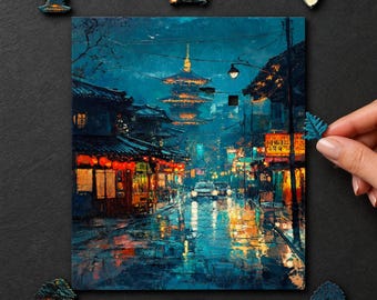 May include: A rectangular jigsaw puzzle depicting a night scene of a Japanese street with a pagoda, illuminated by warm orange lanterns and streetlights, reflecting on a wet road. Several loose puzzle pieces are scattered around the main image.