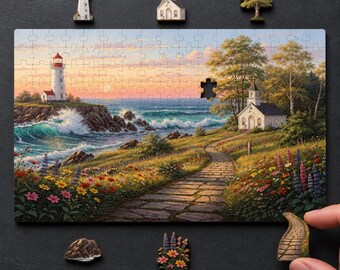 May include: A rectangular jigsaw puzzle featuring a coastal landscape with a lighthouse on a rocky cliff, a stone path leading to a white church, and colourful wildflowers. Several individual puzzle pieces are placed around the main assembly.