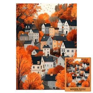 May include: A wooden jigsaw puzzle depicting a vibrant autumn scene of houses surrounded by trees with orange leaves. The puzzle includes a smaller image of the completed puzzle with the text "WOODEN PUZZLE ART COLLECTION".