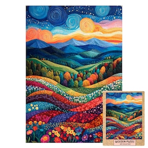 Può includere: Un puzzle rettangolare in legno raffigurante un paesaggio vivace con colline ondulate, campi di fiori colorati e montagne blu in lontananza sotto un cielo stellato. La scatola riporta il testo WOODEN PUZZLE ART COLLECTION.