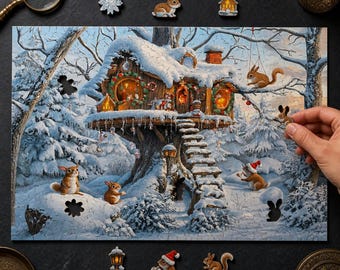 May include: A jigsaw puzzle depicting a snow-covered treehouse in a winter forest, featuring squirrels, a staircase, and festive wreaths. The scene includes scattered puzzle pieces shaped like a snowflake, a rabbit, and a house, with a hand placing a piece.