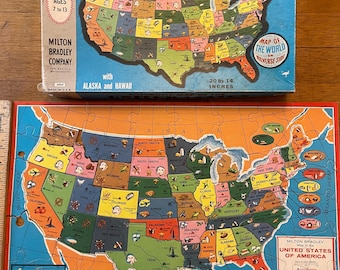 Milton Bradley 1961 double sided puzzle of the United States and a map of the world.