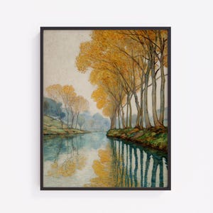 May include: Framed watercolor painting of a river scene. The artwork features a row of tall trees with golden yellow leaves lining the riverbank. The water reflects the trees and sky, creating a mirrored effect. The painting is in a black frame.
