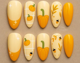 Ongles faits main citrouille d'automne : manucure festive d'automne