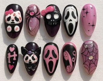 May include: A set of ten artificial nails with various Halloween-themed designs. The designs include a panda with a bow, a spider, a skull with a bow, a Scream mask, stars, hearts, a cat, a phone, and a spiderweb.