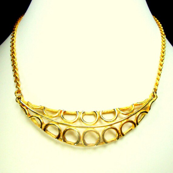 Tiny Goldtone Metal  Loop de Loop Crescent Bib on… - image 1