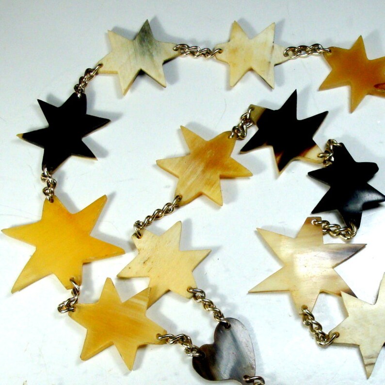 The 6 Pt Stars are A Handsome Array Of Natural Colors LONG Buffalo HORN Stars /& EAGLE Pendant on Gold Chain Necklace Tan to black