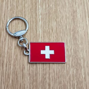 Flag Swiss keychain pendant Metal enamel color classic flags of countries. Ring with rotating spring. Keychain for gift.