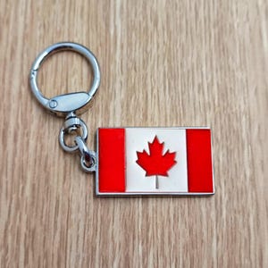 Flag Canada keychain pendant Metal enamel color classic flags of countries. Ring with rotating spring. Keychain for gift.