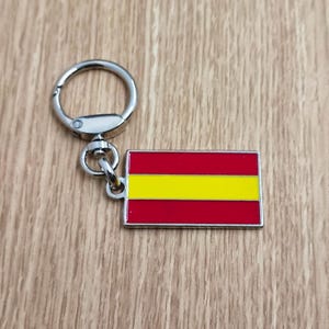 Flag Spain keychain pendant Metal enamel color classic flags of countries. Ring with rotating spring. Keychain for gift.