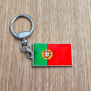 Flag Portugal keychain pendant Metal enamel color classic flags of countries. Ring with rotating spring. Keychain for gift.