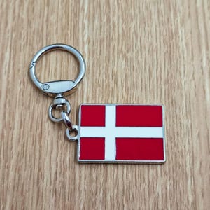 Flag Denmark keychain pendant Metal enamel color classic flags of countries. Ring with rotating spring. Keychain for gift.