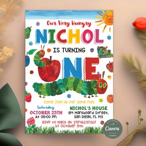 May include: A colorful invitation for a first birthday party featuring a caterpillar and an apple. The invitation says "Our Very Hungry Nichol is Turning One" and includes the date, time, and location of the party. RSVP information is also included.