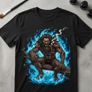 May include: Black t-shirt featuring a detailed illustration of a muscular, bearded figure smoking a cigar while seated on a tree branch, surrounded by blue flames. The artwork has a fantasy theme.