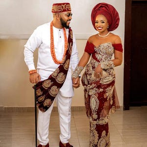 Traditionele Afrikaanse bruidsoutfit: korsetjurk Agbada-kant