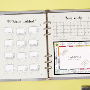 May include: A grey binder with two pages open. The left page has a section labelled "TV Shows Watched" with 12 television icons. The right page has a section labelled "Save-opoly" with a calendar and a game board.