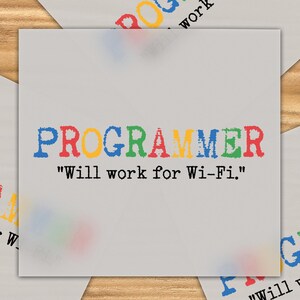 May include: A collection of light gray cards with the word "PROGRAMMER" printed in colorful letters. The text "Will work for Wi-Fi." is below the word. The cards are arranged on a wooden surface.