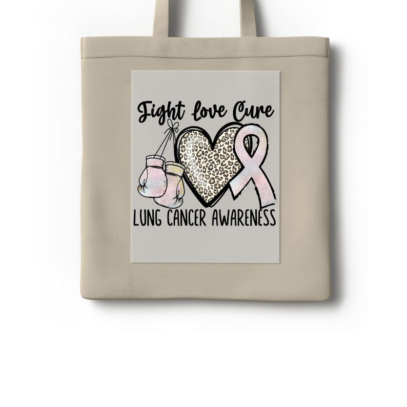 The image is a tote bag with a graphic design that says "Fight love Cure Lung cancer awareness".