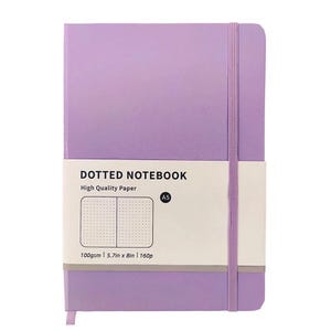 May include: A lavender dotted notebook with a matching elastic band closure. The notebook has a white band across the front with the text "DOTTED NOTEBOOK" and "High Quality Paper". The notebook is 5.7in x 8in and has 160 pages.