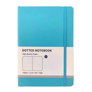 May include: A turquoise A5 dotted notebook with a matching elastic band closure. The notebook features a white label with the text "DOTTED NOTEBOOK" and "High Quality Paper". The label also includes a diagram of the dotted paper and the specifications: 100gsm | 5.7in x 8in | 160p.