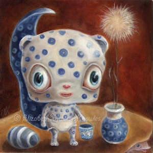 May include: A blue and white spotted creature with large eyes and a pink nose holds a blue and white bucket. The creature is standing on a brown surface with a blue and white vase and a white and grey stone. A white, fluffy flower is in the vase.