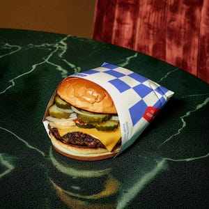 Fast Food Burger and Fries Packaging mockup in a realistic scene with editable PSD layers, perfect for branding design