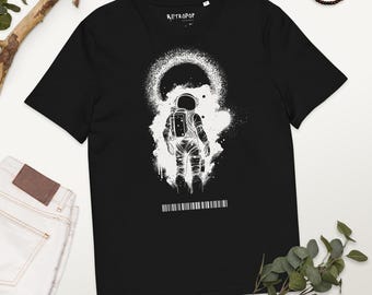 May include: Black t-shirt with a white graphic of an astronaut walking away from a black hole. The graphic also includes a barcode and the text "RETROPOP".