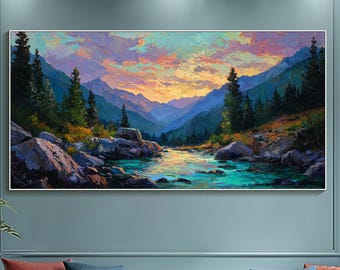 May include: A framed landscape painting depicts a river flowing through a mountain valley under a colorful sunset. The artwork hangs above a white tufted sofa with red and blue throw pillows. A black ottoman and patterned rug complete the living room setting.
