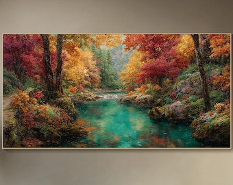 May include: A framed landscape painting depicts a vibrant autumn scene. The artwork showcases a river with turquoise water flowing through a forest of trees with red, orange, and yellow foliage. The painting is displayed above a gray sofa.
