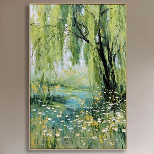 May include: An oil painting depicts a serene landscape with a weeping willow tree. The artwork features a vibrant color palette of greens, yellows, and blues, with delicate white flowers scattered throughout the scene. The painting is framed in a gold-colored frame.