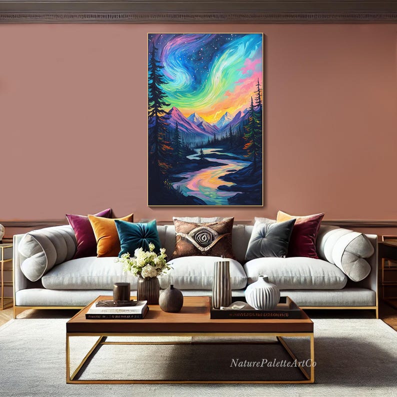 May include: A painting of a colorful aurora borealis over a mountain range and a river winding through a forest. The sky is a vibrant mix of pink, purple, blue, and green. The mountains are dark blue and the river is a reflective silver.