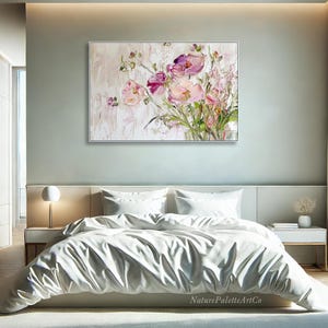May include: A painting of a bouquet of pink and purple flowers in a vase. The flowers are painted in a realistic style with visible brushstrokes. The background is a light beige color.