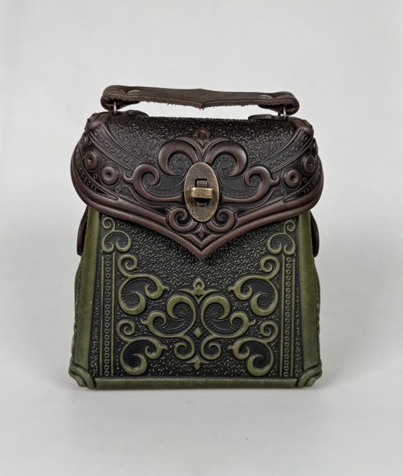 brown leather backpack embossed Lusso Chicago Blackhawks Saxan CBH Shop pull the drawstring and close the flap Lusso Chicago Blackhawks Saxan Leather