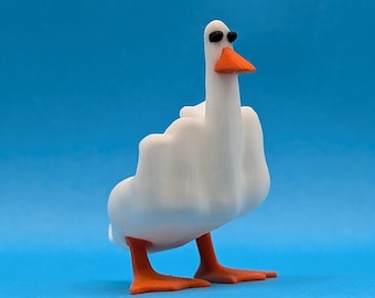 May include: A white goose figurine with orange feet and a black beak. The goose is wearing sunglasses.