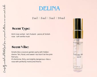 May include: A gold and clear glass bottle of perfume with a gold cap. The bottle is labeled "Perfume No. BRAND" and has a measurement scale on the side. The text "DELINA" is written in blue at the top of the image. The text "2ml 3ml 5ml 10ml" is written below the brand name. The text "Scent Type: litchi rose sorbet - tart rhubarb - peony & Turkish rose - soft vanilla musk" is written below the size options. The text "Scent Vibe: Smells like a couture garden party with hidden drama. Tart, floral, and sweet-but don't let the pink fool you. It's feminine, flirty, and slightly dangerous-like a rose with perfectly manicured thorns." is written below the scent type.