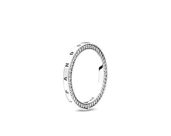May include: A silver ring with a double row of small, clear stones. The ring has the word "PANDORA" engraved on the side. The ring is set against a white background.