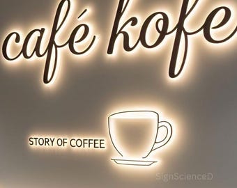 Letrero metálico personalizado con logotipo empresarial, retroiluminado por LED, para montaje en pared.