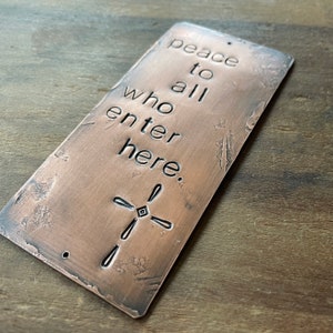 peace to all who enter here  - cross - warm copper passages plaque