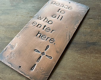 peace to all who enter here  - cross - warm copper passages plaque