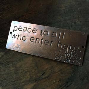 peace to all who enter here  - warm copper passages plaque