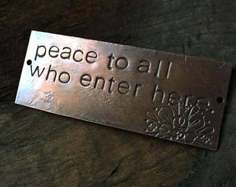 peace to all who enter here  - warm copper passages plaque