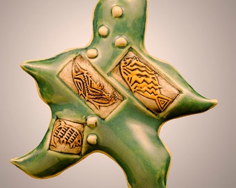 Wavy Pottery Star with Fish Impressed into the sides